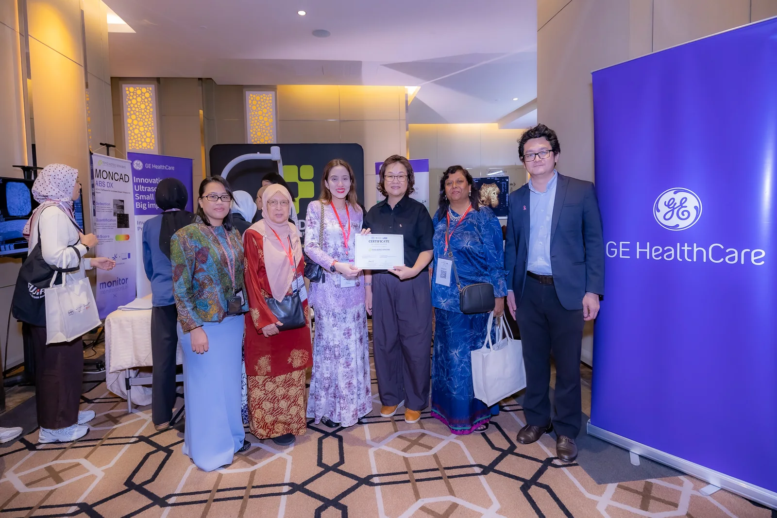 Participants posing together at a professional event.